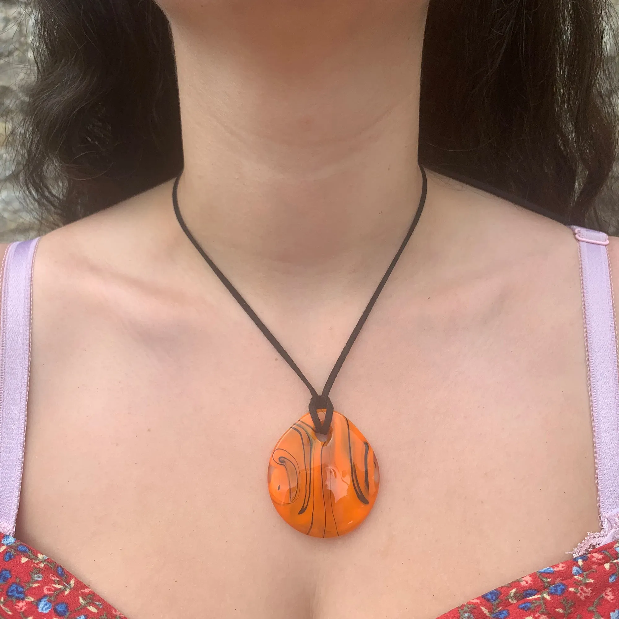 Necklace with orange pastel Murano glass near circular medium flat pendant